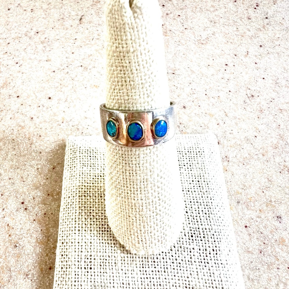 3 Australian Opals set in 14 KT Gold on Sterling Silver Band